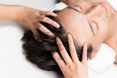 men are receiving a head massage.