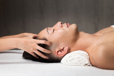 men are receiving a head massage.