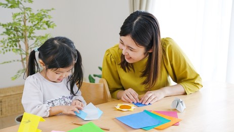 asian child playing in the living room