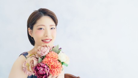 young asian woman holding a bouquet. beauty concept. skin care. cosmetics.