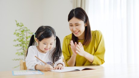 a child studying in the living room
