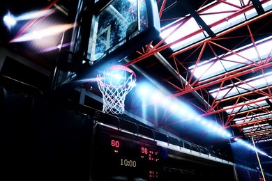 basketball theme with basket, scoreboard and sport hall lights