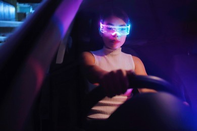 fashion cyberpunk girl drive a supercar. asian woman  with future digital glasses,future technology concept