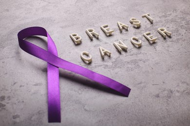 purple ribbon for alzheimer's disease, pancreatic cancer, epilepsy awareness, breast cancer, world cancer day