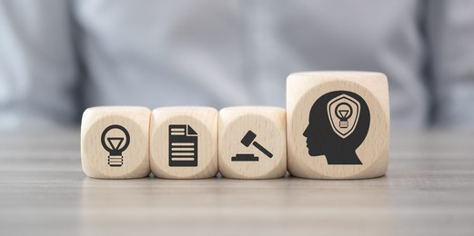 wooden blocks with symbol of intellectual property concept