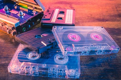 old vintage audio cassettes on wooden surface. retro music format of the eighties. colorful analog hifi concept.