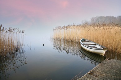 lake of sjaelso and boat in denmark in autumn