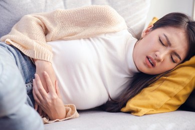attractive woman stomach ache menstrual pain stomach disease, intestinal disease, gastrointestinal disease