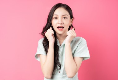 young asian woman with scared look	