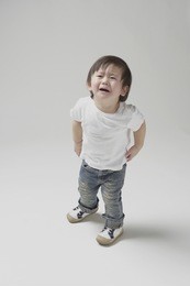 2 year-old boy looking up and almost crying