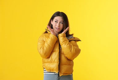 beautiful young asian woman on yellow background