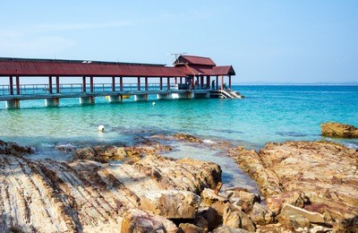 a jetty by a rocky beach at pulau kapas, terengganu malaysia