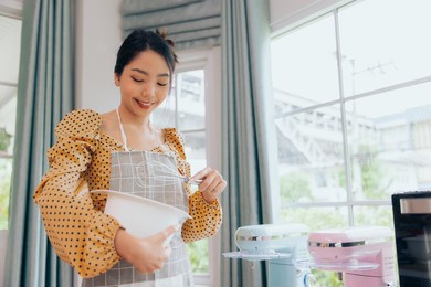 young asian female preparing flour and ingredient making bakery bread, food and cuisine homemade concept