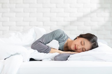 beautiful attractive asian woman sleep and sweet dream lying on bed in cozy bedroom in the morning feeling so relax and comfortable.healthy young female sleep with bedtime at home.healthcare concept