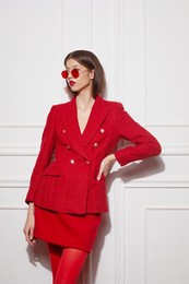 fashion asian female model in red jacket and skirt. high fashion