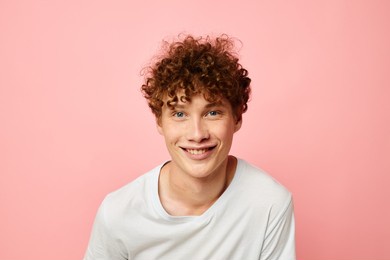 guy with red curly hair in white t-shirt casual wear emotions isolated background unaltered