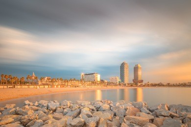 barceloneta beach in barcelona with colorful sky at sunrise