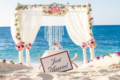 beach wedding set up, tropical outdoor wedding reception, beautiful cabana, wedding arch