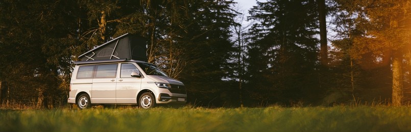modern new camping van parking at the forest in beautiful, authentic nature. 