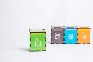 environmentally friendly garbage sorting board game, the selective focus is isolated on a white background. the game garbage cans for sorting garbage, teaching children