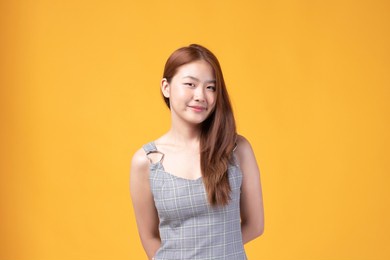 portrait of beautiful young asian girl model long hair in casual summer clothes smile, happy and enjoying in studio isolated on white background.