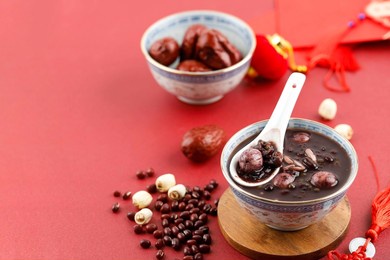 eight treasure congee, traditional chinese festive porridge, laba festival, lantern festibal, chinese new year. copy space for text, red concept