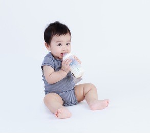thai baby drinking milk isolated  