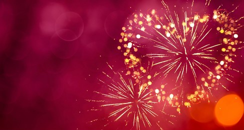 beautiful holiday background for valentine's day. heart of fireworks on red bokeh background. abstract template with copy space for design flyer, greeting card. love concept