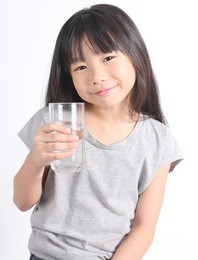 young little girl drinking water.