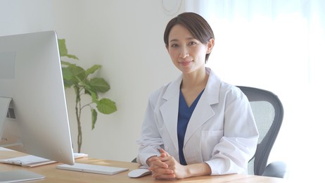 asian female doctor laughing with a smile