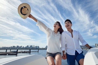 romantic young couples aboard a yacht out to sea