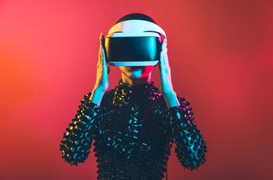 modern beauty portrait. young woman with shaved head and virtual reality visor glasses