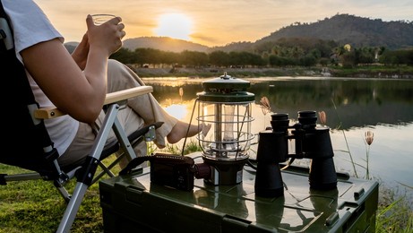 asian woman travel and camping alone at natural park in thailand. recreation and journey outdoor activity lifestyle.