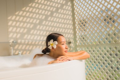 portrait young asian woman relax take a bath in bathtub for spa concept
