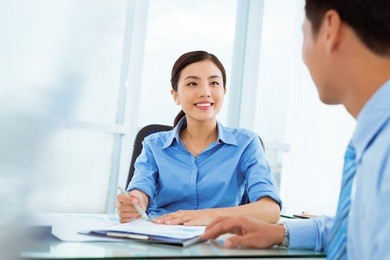 pretty vietnamese manager interviewing job candidate