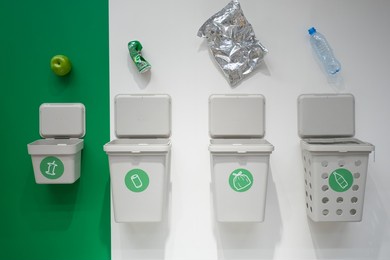 garbage cans for separate garbage collection. food waste tank, paper trash, plastic waste tank and metal can tank. the concept of environmental conservation