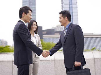 business people shaking hands.