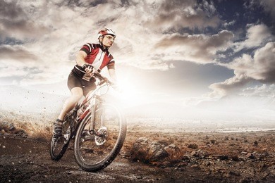 mountain bike cyclist riding single track above sunset valley