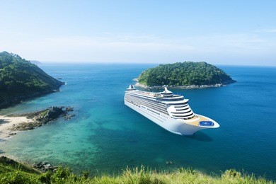 cruise ship in the ocean with blue sky