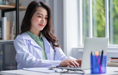 image of asian female doctor working at clinic
