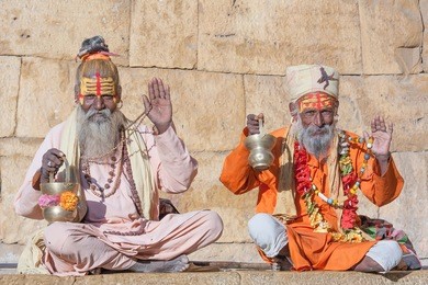 hindu sadhu holy man, sits on the ghat