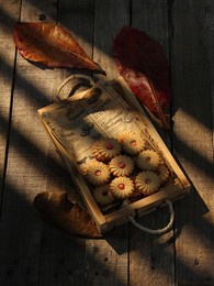 cookies with strawberry filling. capture in dramatic lightning at the golden hour. darkmood photography.