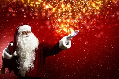 santa clause with gift bag behind shoulders