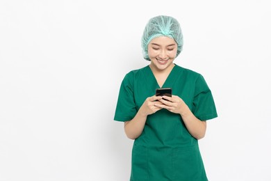 asian nurse or doctor woman using mobile phone isolated over white background