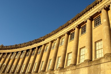 exterior view of the landmark royal crescent buildings in the city of bath in somerset england - the royal crescent comprises of beautiful georgian era luxury terraced houses