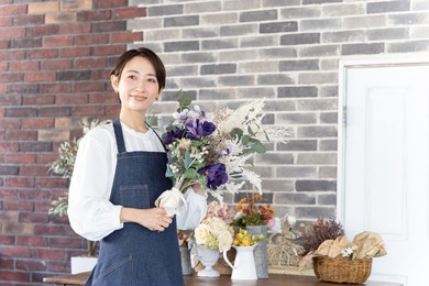 asian woman working in a flower shop