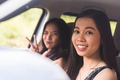 two young pretty women hanging out. strolling around the street. catching up with their friendship.