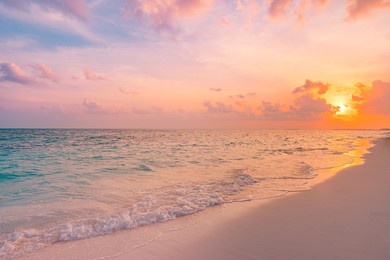 closeup sea sand beach. beautiful beach landscape. inspire tropical beach seascape horizon. dreamy sunset sky calm tranquil relax sunset summer mood. positive energy, meditation summer tropical island
