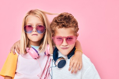 funny little boy and girl in sunglasses have fun with friends casual kids fashion