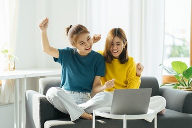 excited female feeling euphoric celebrating online win success achievement result, young asian woman happy about good email news, motivated by great offer or new opportunity.